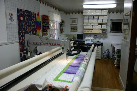 Longarm quilting machine with a quilt on the frame, Public Domain image by Jessica Hartman